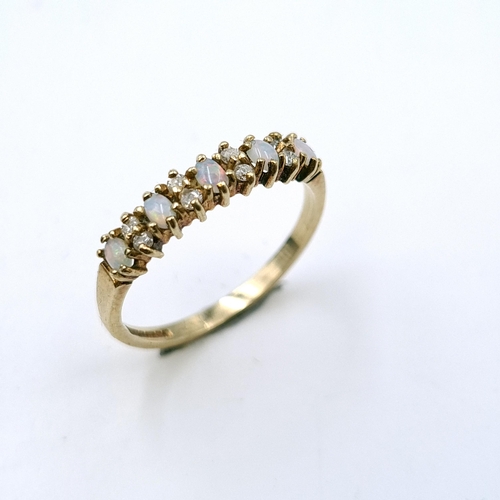 926 - Star Lot : A beautiful diamond and opal half eternity ring set in nine carat gold. Ring size - N. We... 