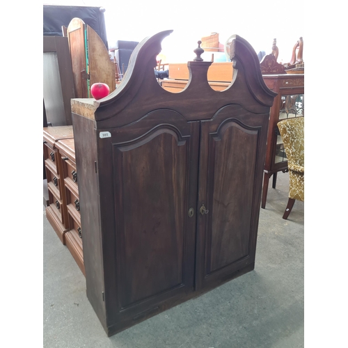 985 - An impressive large gothic style storage cupboard with double doors opening to reveal four internal ... 