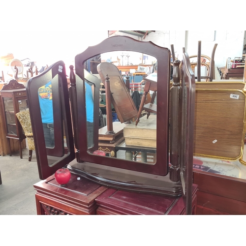 987 - An attractive tri fold  cherrywood vanity table top mirror.