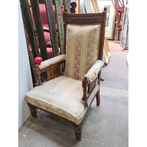 988 - An antique, edwardian armchair. With reeded detail, carved foliate motifs and original upholstery. O... 