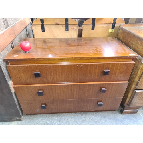 990 - A  handsome mid century chest of drawers with three good sized drawers all featuring square handles.