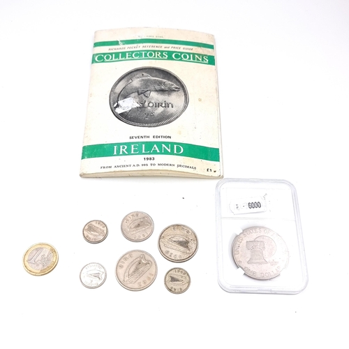 982 - Irish reference coin book and some Irish coins including silver examples.