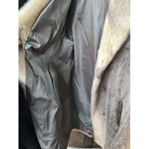 376 - Star Lot  : An unusual and stylish vintage fur coat in a black and white shade from Lichtblau. Appro... 