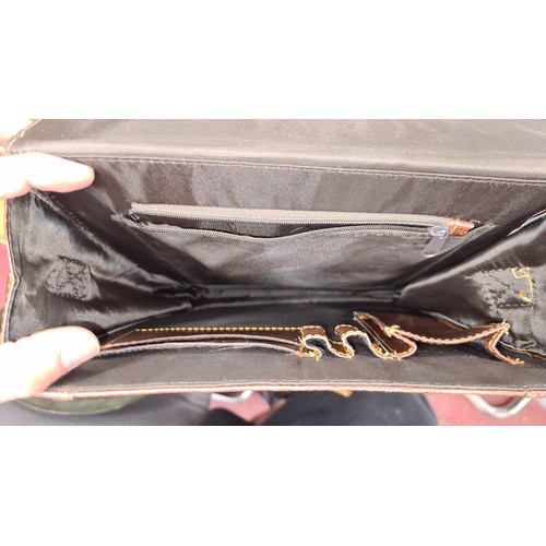 208 - A super stylish brown leather Ralph Lauren branded satchel bag complete with shoulder strap, interna... 