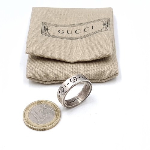 365 - Star Lot: A fabulous Gucci Designer ring 'Ghost' set with Gucci monogram detailing to band. Ring siz... 