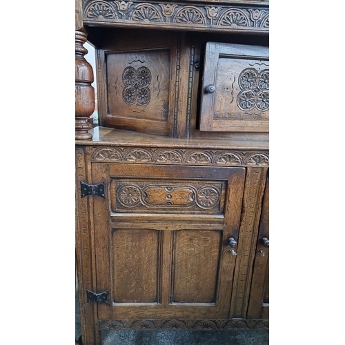 378 - Star Lot : A Hand-carved oak sideboard, intricate floral and geometric designs, turn-of-the-century ... 