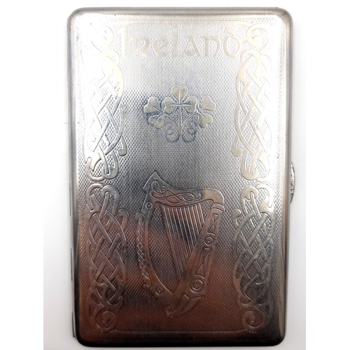 13 - A sterling silver cigarette case with gilt interior with celtic Irish decoration to lid. Dimensions ... 