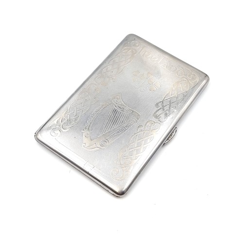 13 - A sterling silver cigarette case with gilt interior with celtic Irish decoration to lid. Dimensions ... 