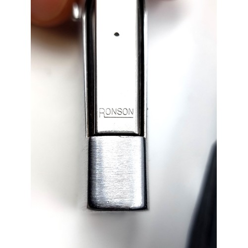 14 - A Ronson gas lighter in polished satin finish. Comes in original presentation box.