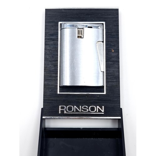 14 - A Ronson gas lighter in polished satin finish. Comes in original presentation box.