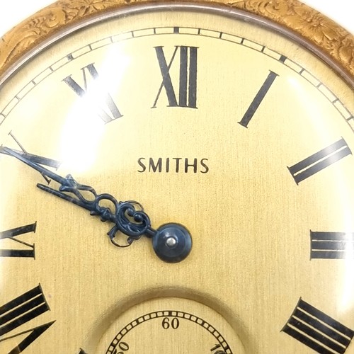 17 - A gold toned Smiths  top wind pocket watch with gold face and black roman numeral figures. Watch has... 