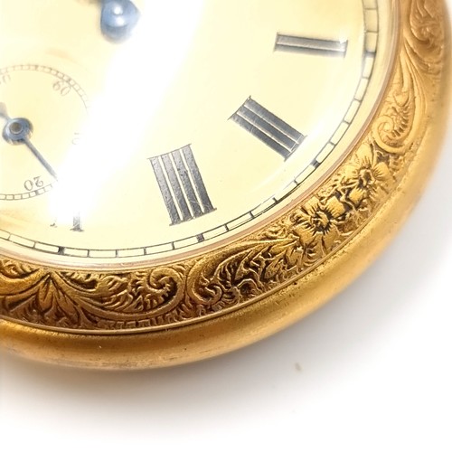 17 - A gold toned Smiths  top wind pocket watch with gold face and black roman numeral figures. Watch has... 