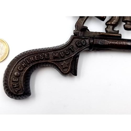 977 - An antique 19th century American cast iron cap gun. Created in the peak of Anti-Chinese sentiment an... 