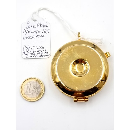 980 - A gold plated pyx communion set with I.H.S inscription.