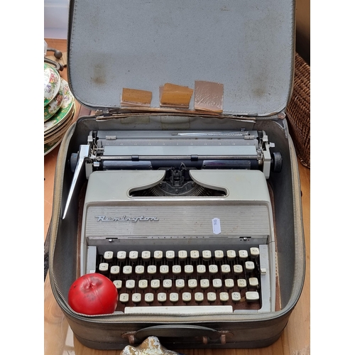 422 - A vintage Remington Fleetwing typewriter in original zip carry case, made in Holland.