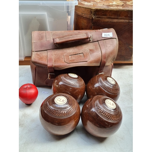 424 - A set of four antique Scottish Taylor-Rolph CO LTD wooden crown green bowls, in vintage carry case.