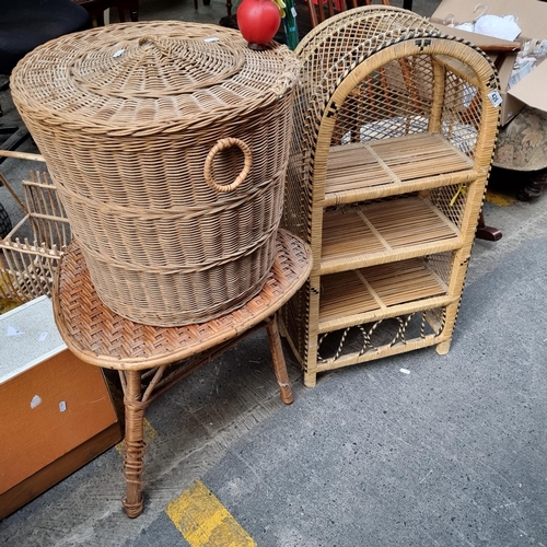 426 - Three bohemian chic household items including a three tier shelving unit, a medium size linen basket... 