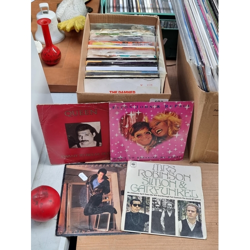 429 - A box containing a large selection of seven inch vinyl records including artists such as Bruce Sprin... 