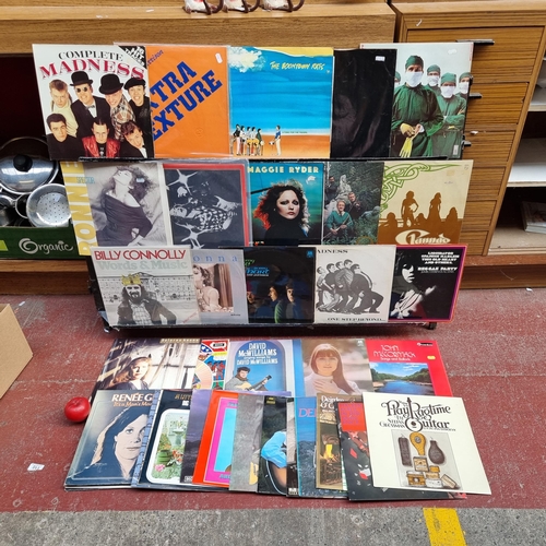 431 - A box containing a selection of vinyl records, all with original sleeves. Including artists such as ... 