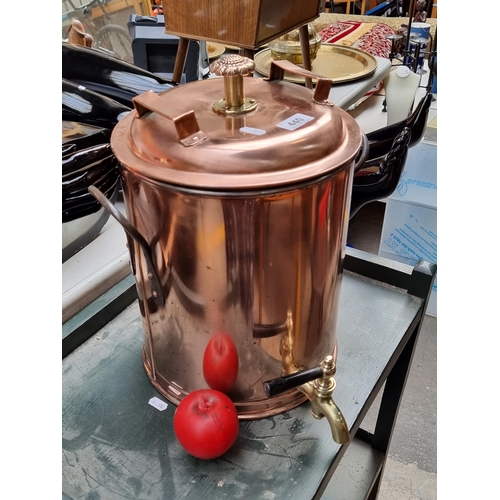 440 - Star Lot : A stylish vintage copper and brass double handled beverage dispenser with faucet to front... 