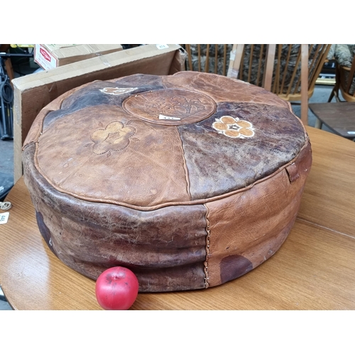 441 - A  superb vintage Moroccan tooled circular pouffe with hand stitched floral and animal motifs