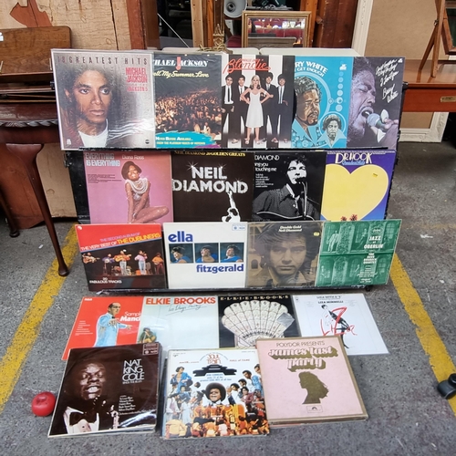 464 - A bag containing a mixed selection of vinyl records including artists such as Micheal Jackson x 2, B... 