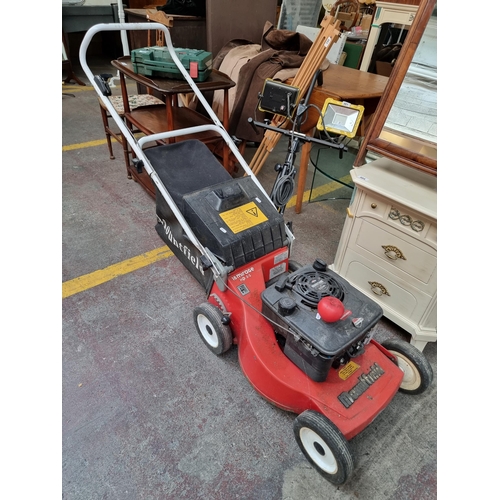 475 - A high quality Briggs and Strattan 'Mountfield' petrol lawnmower complete with grass catcher bag