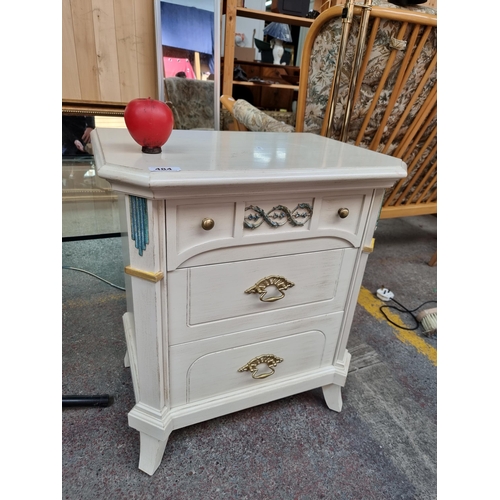 484 - A lovely French bedside locker featuring three nicely sized pull out drawers with brass hardware and... 