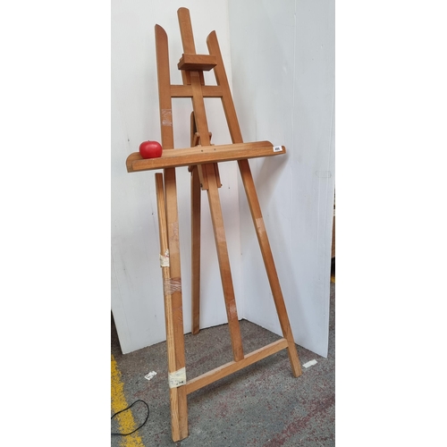 486 - A good full size adjustable wooden artists easel