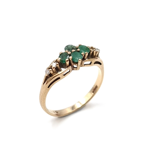 15 - Star Lot : A nine carat gold (375) emerald and diamond set ring. Ring size - N. Weight - 2.1 grams. ... 