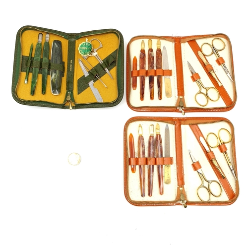 46 - A collection of three leather manicure set. Two in faux tortoise shell and one set in faux jade.