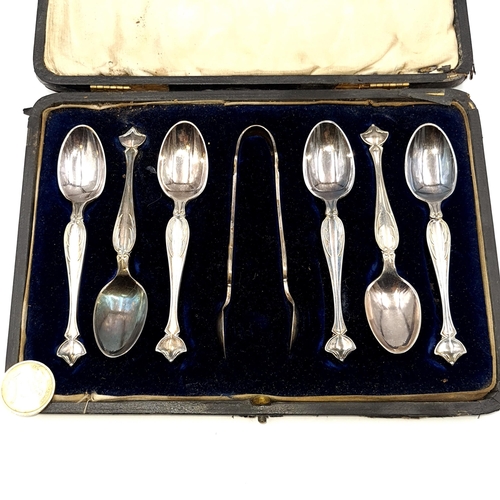 49 - A very nice set of six white metal teaspoons together with sugar tongs. Presented in original presen... 