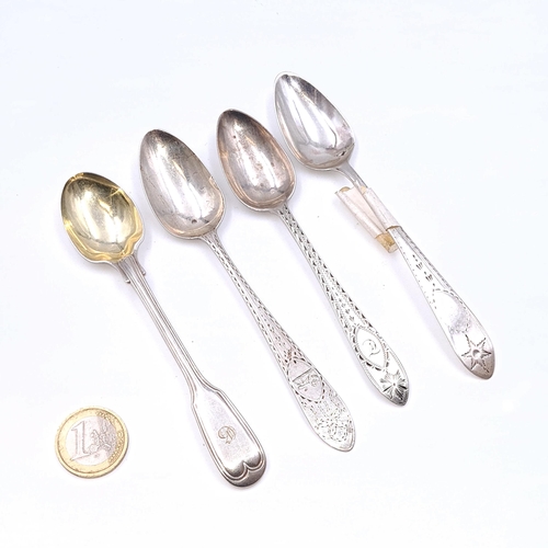 503 - A collection of four assorted Irish silver teaspoons (Dates indistinct). Total weight - 64.14 grams.