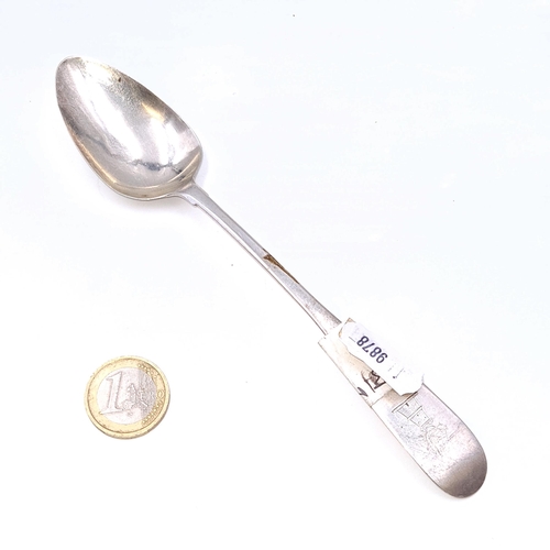 506 - A large Irish silver dessert spoon. Date marks indistinct. Length - 17 cms. Weight - 22.74 grams.