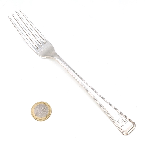 60 - A large sterling silver dinner fork hallmarked London - 1937. Length - 20 cms. Weight - 58.43 grams.