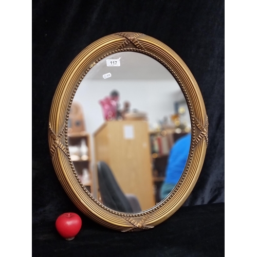 117 - An attractive early 20th century antique Victorian style giltwood oval mirror.