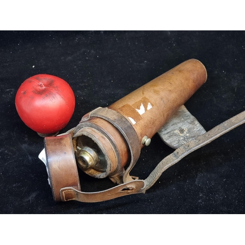 140 - An antique glass hunting saddle flask with silver collar in original brown leather case.