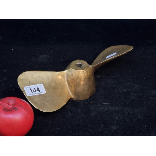 144 - A twin blade heavy solid brass nautical propeller.