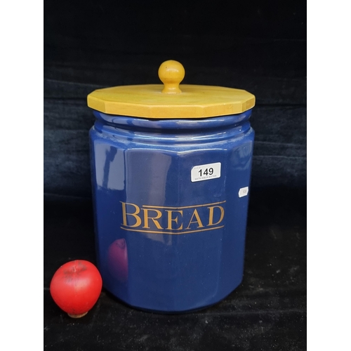 149 - A large heavy ceramic Bread bin / lidded jar in a navy finish with wooden lid.