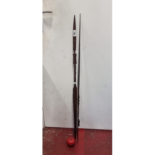 150 - Two fascinating hand carved African tribal hunting spears / daggers.