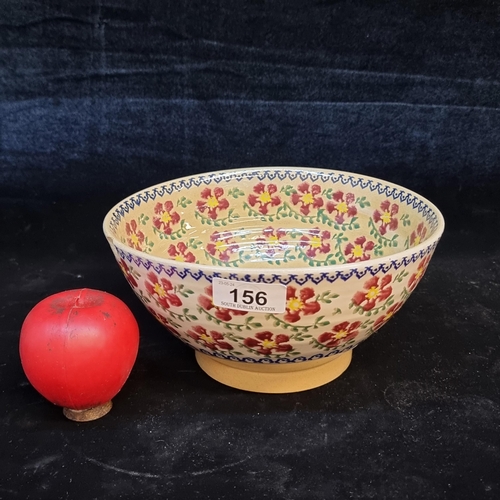 156 - A very pretty large Nicholas Mosse Irish pottery bowl. Hand painted in his known floral patterns. Sl... 