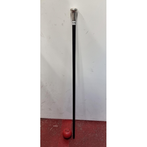 178 - A rather handsome swagger stick / cane with an engraved Birmingham silver top with hallmarks dating ... 