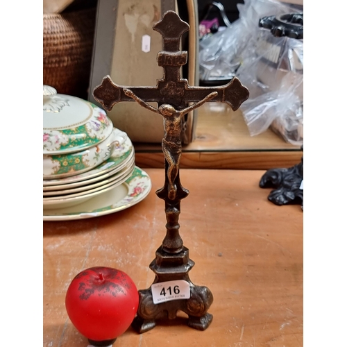 416 - A cast metal figurine of the Crucifix with bronze finish.