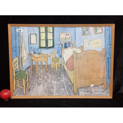 A Musee d'Orsay print / poster of a Vincent Van Gogh original painting titled 'Bedroom in Arles'. Housed in a wooden frame behind glass.