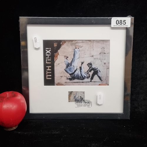 85 - A print of a Banksy mural with original stamp. Features a man resembling Russian President being fli... 