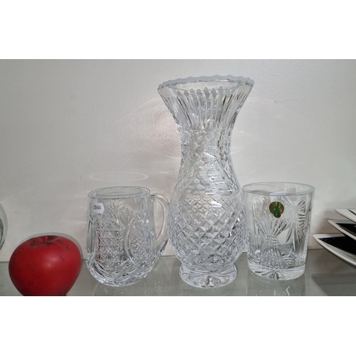 726 - A Waterford Crystal collection, including a vase, mug, and tumbler, featuring intricate cut designs ... 