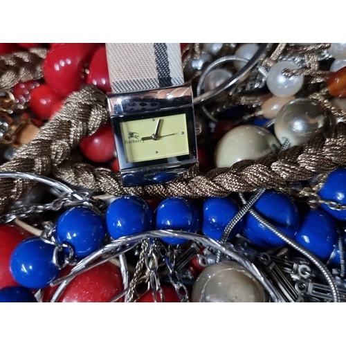 750 - A mixed lot including assorted beaded necklaces and a Burberry wristwatch, presented in a vintage wo... 