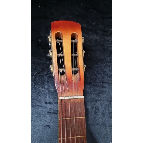 757 - Vintage Acoustic Guitar with a soft carrying case and classic slotted headstock. Features a warm nat... 