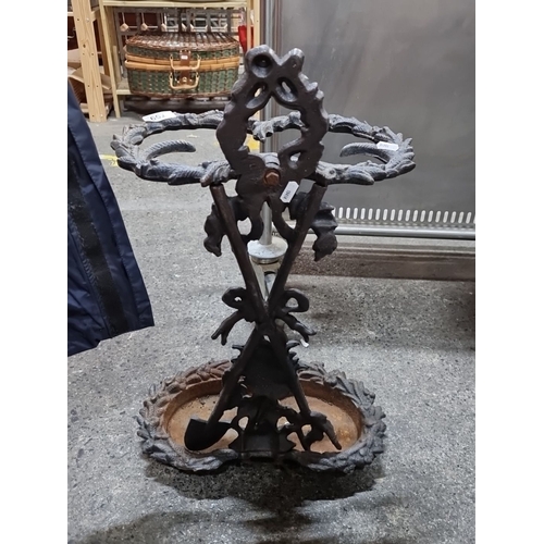 759 - Intricately designed Victorian  cast iron candle holder featuring a complex arrangement of leaf moti... 