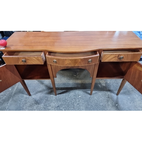 770 - Elegant mid-century modern sideboard featuring rich mahogany with multiple drawers and a sleek curva... 